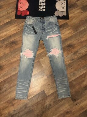 Amiri Light blue Distressed Jeans with Pink Patch